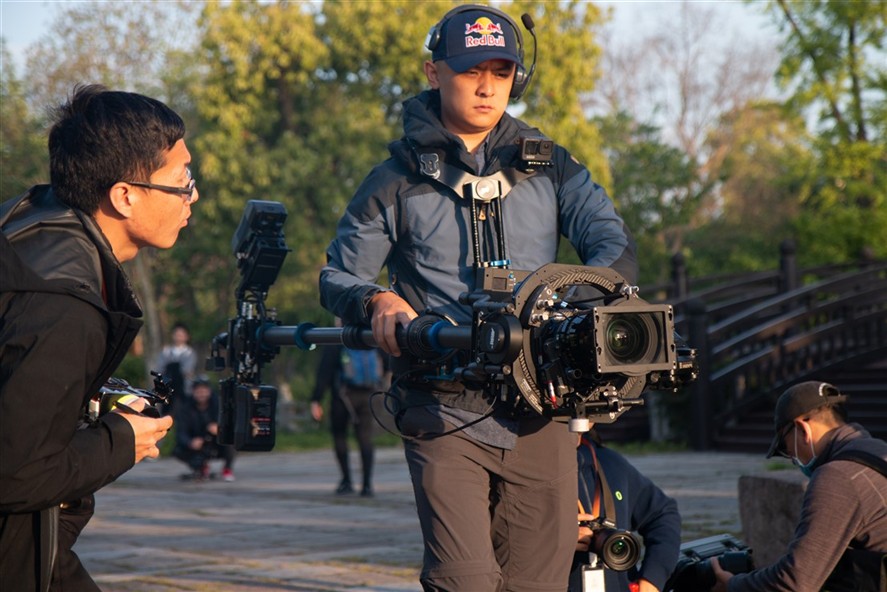 Crew operating a gimbal during a production day in Shenzhen
