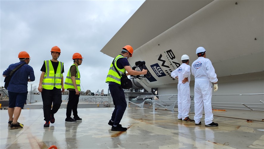 Industrial filming crew working on a large shipyard site in South China
