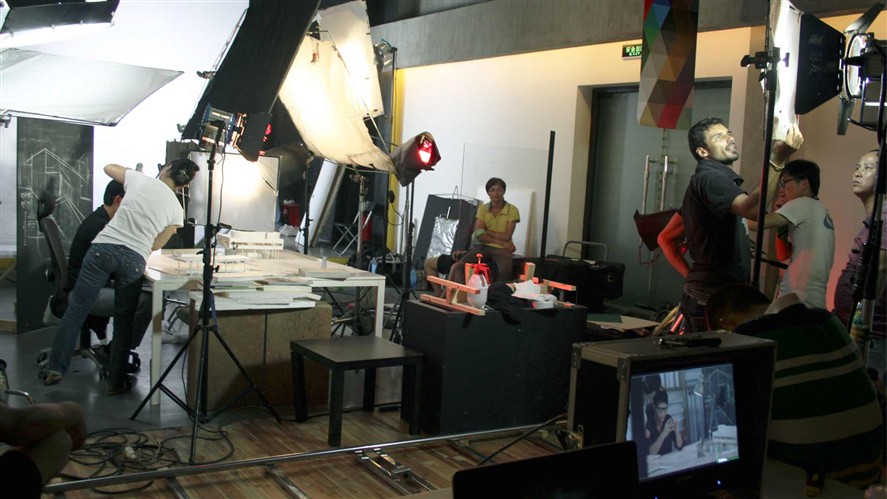 Studio crew working on a set during a China production